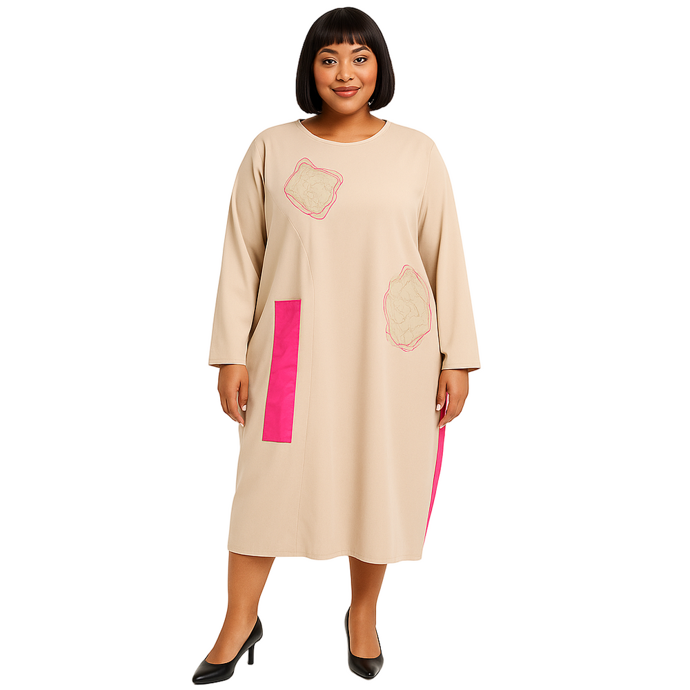 Woman wearing a beige dress with pink accents on a white background