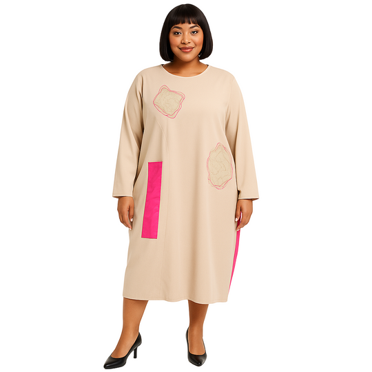 Woman wearing a beige dress with pink accents on a white background