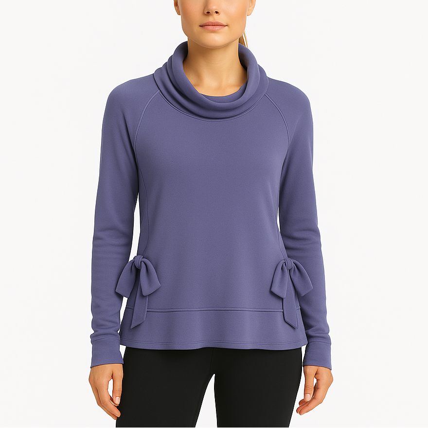 Woman wearing a purple long-sleeve top with cowl neck and bow details on a white background