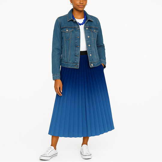 Woman wearing a blue denim jacket and pleated blue skirt on a white background