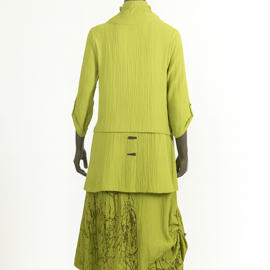 Green two-piece outfit on a mannequin against a white background
