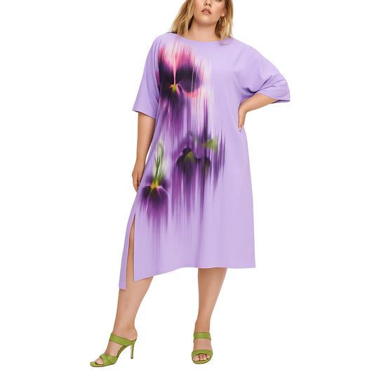 Woman wearing a purple dress with floral design on a white background