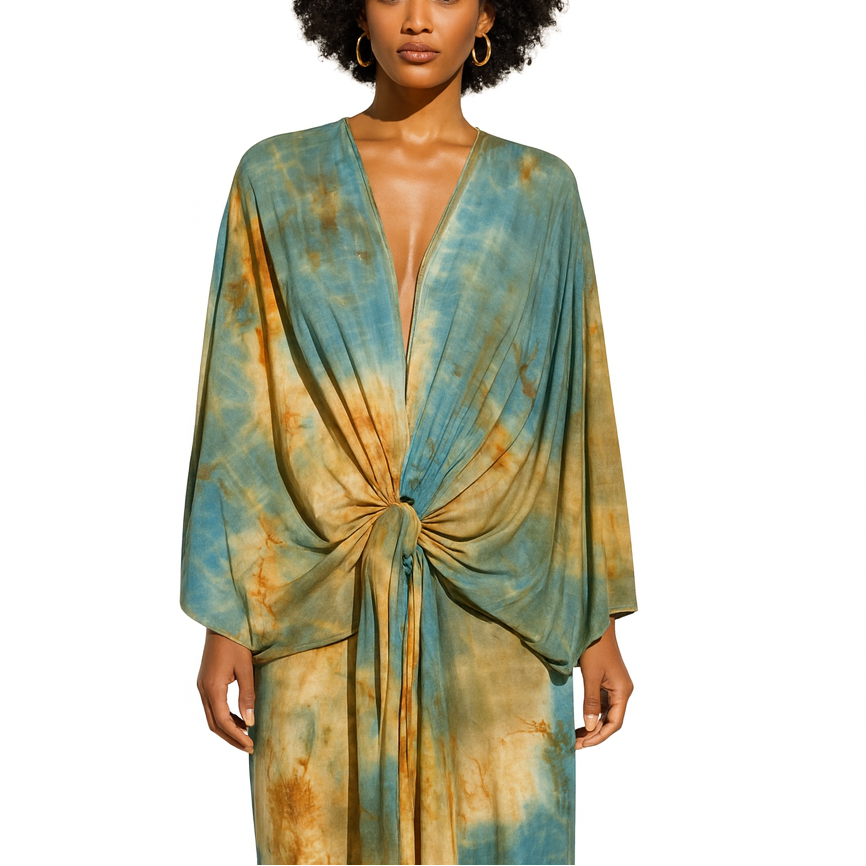 Woman wearing a tie-dye dress with a white background