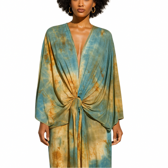 Woman wearing a tie-dye dress with a white background