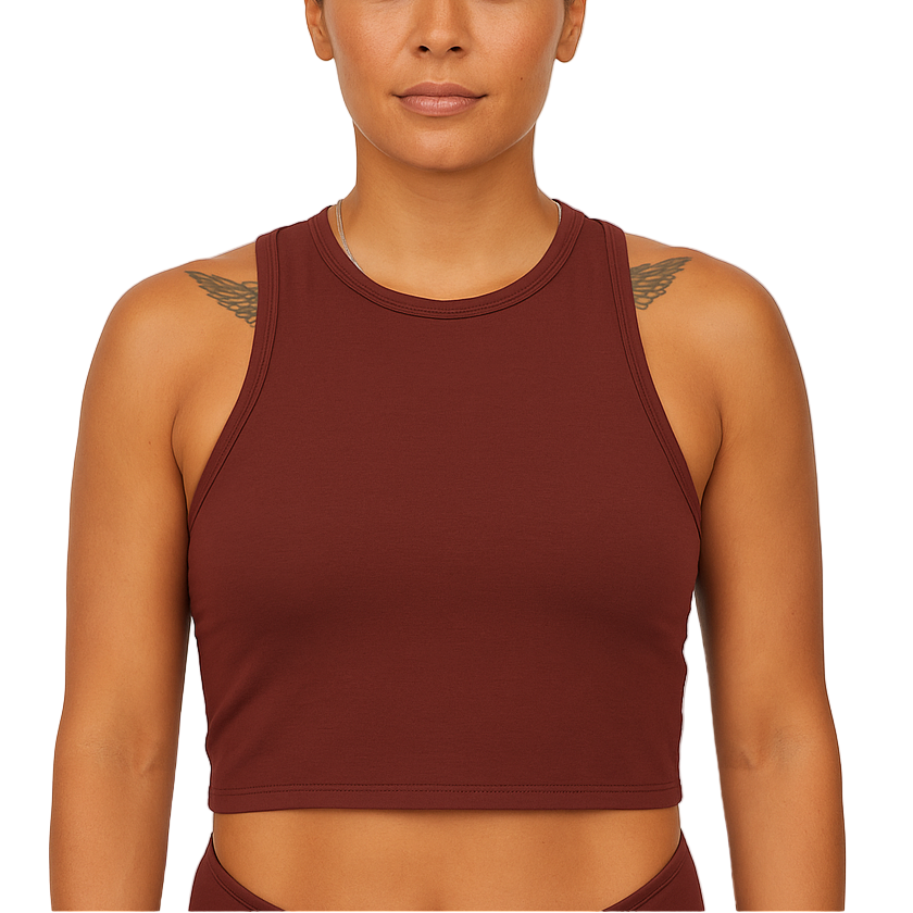 Woman wearing a brown sports bra against a plain background