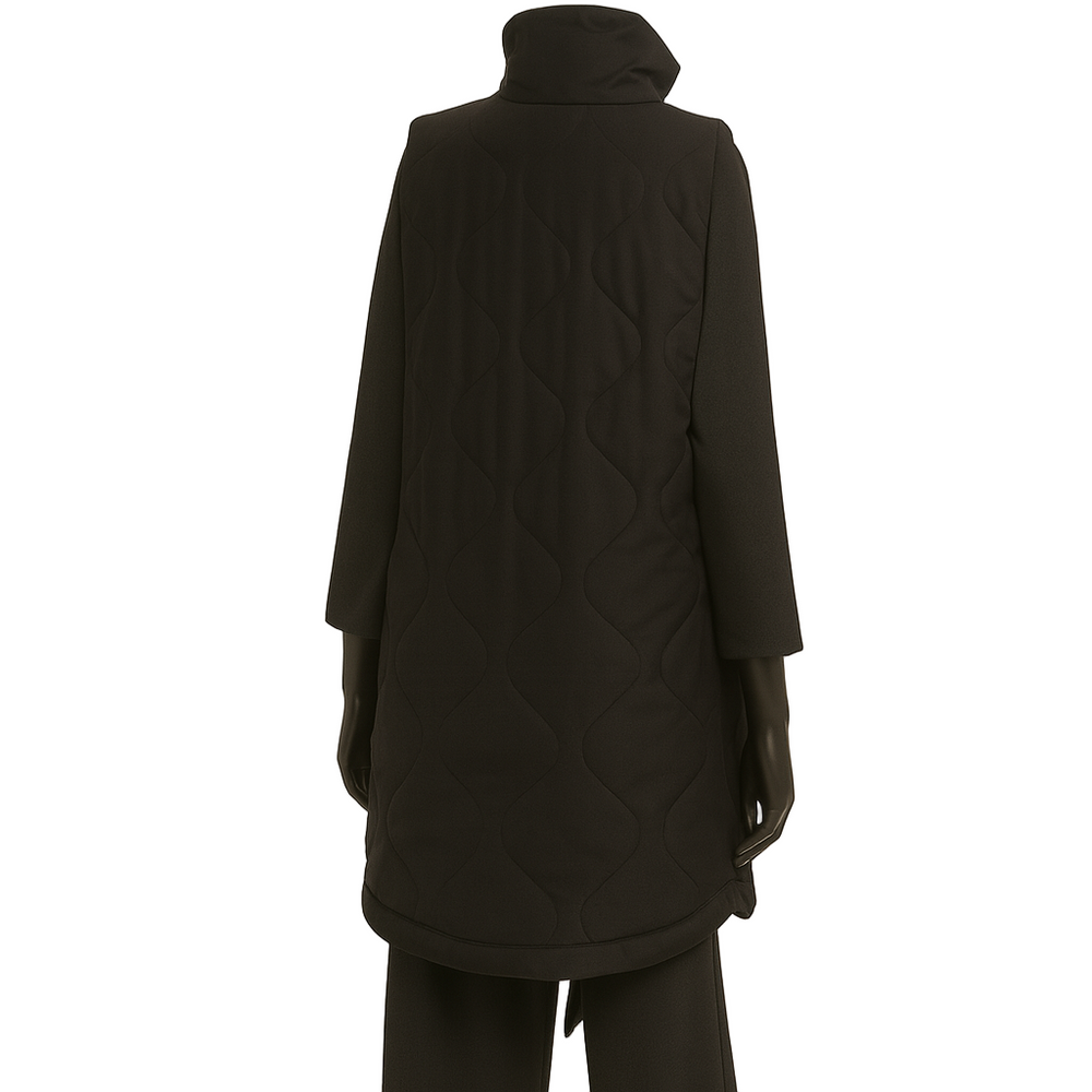 Person wearing a black coat and pants on a white background
