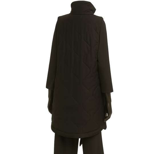 Person wearing a black coat and pants on a white background