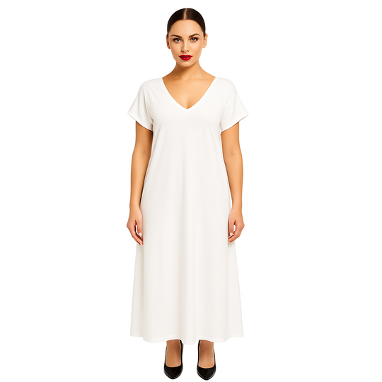 Woman wearing a white dress against a plain background