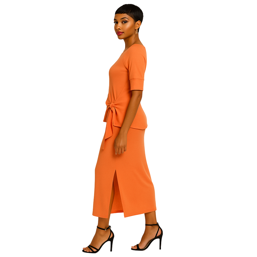 “Model wearing Southcott Threads Caraway Sweater and Shelby Skirt in Papaya – sustainable knit two-piece outfit”