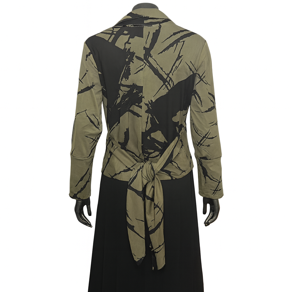 Green and black patterned shirt with a tie on a white background