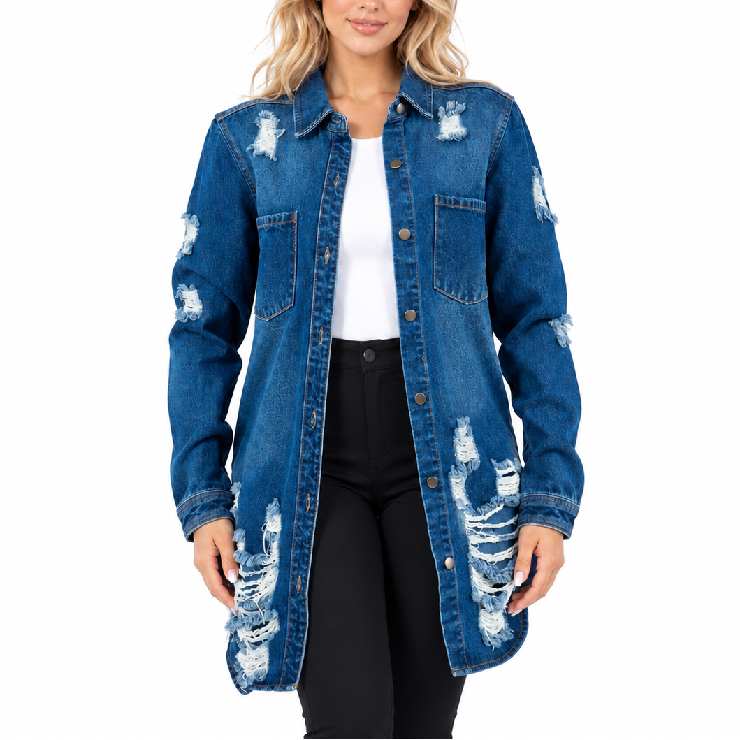 A woman modeling a distressed blue denim shirt jacket over a white top and black pants, photographed against a plain white studio background.