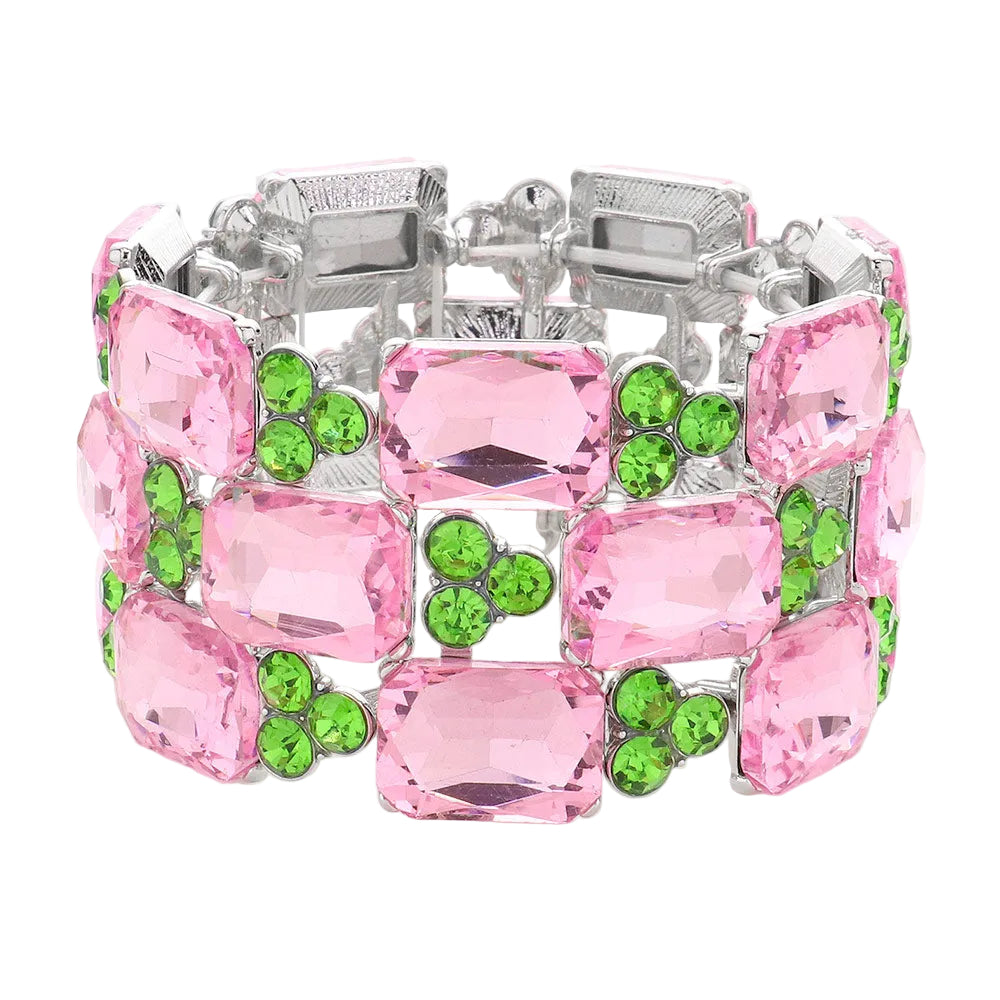 Bracelet with pink and green gemstones on a white background