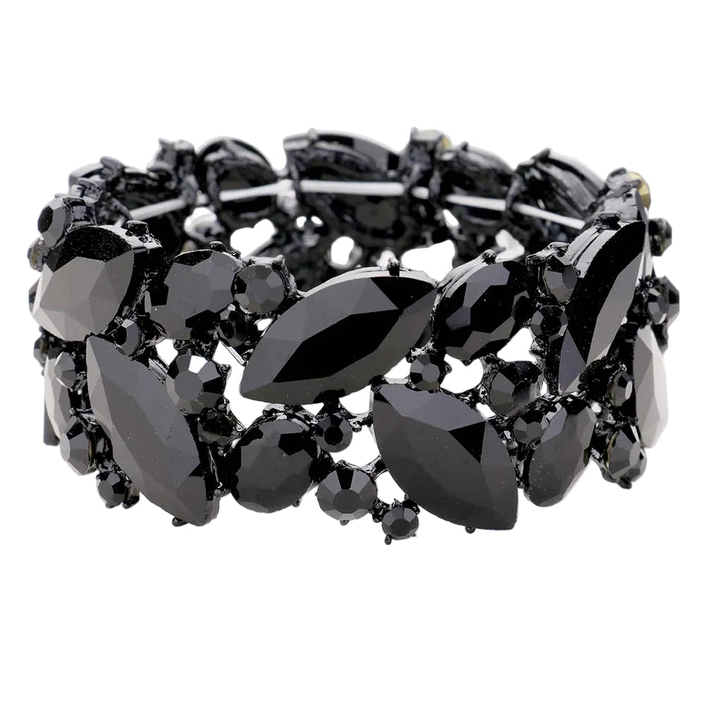 A black gemstone bracelet featuring marquise and round faceted stones in a clustered setting, photographed on a light gray background.