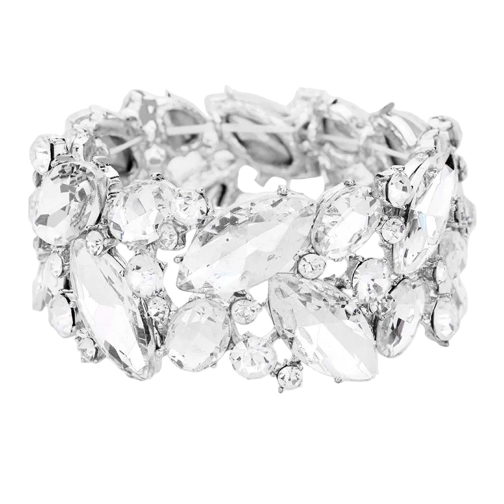 Silver ring with clear gemstones on a white background