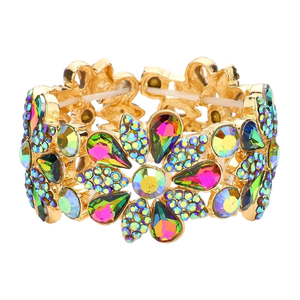 Gold bracelet with colorful gemstones on a light gray background