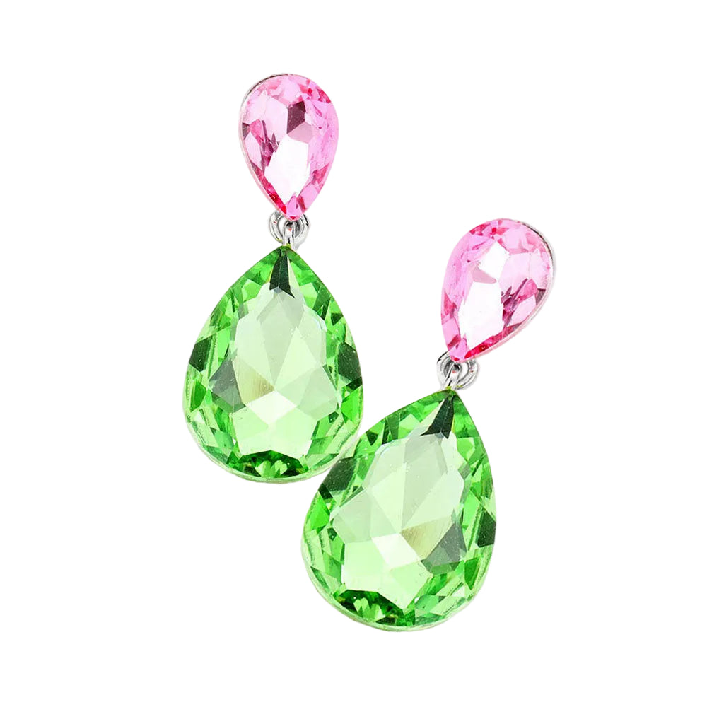 Pair of earrings with pink and green teardrop-shaped gemstones on a white background