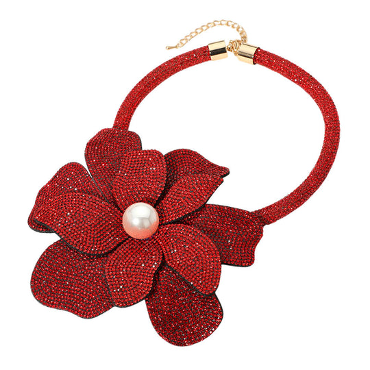 Red flower-shaped necklace with a pearl center on a white background