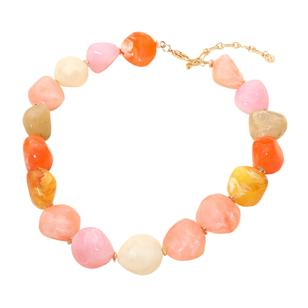 Necklace with multicolored beads on a white background