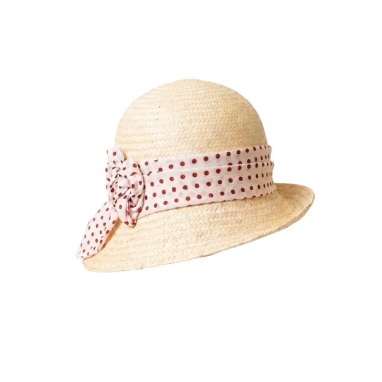 Straw hat with a polka dot ribbon on a white background
