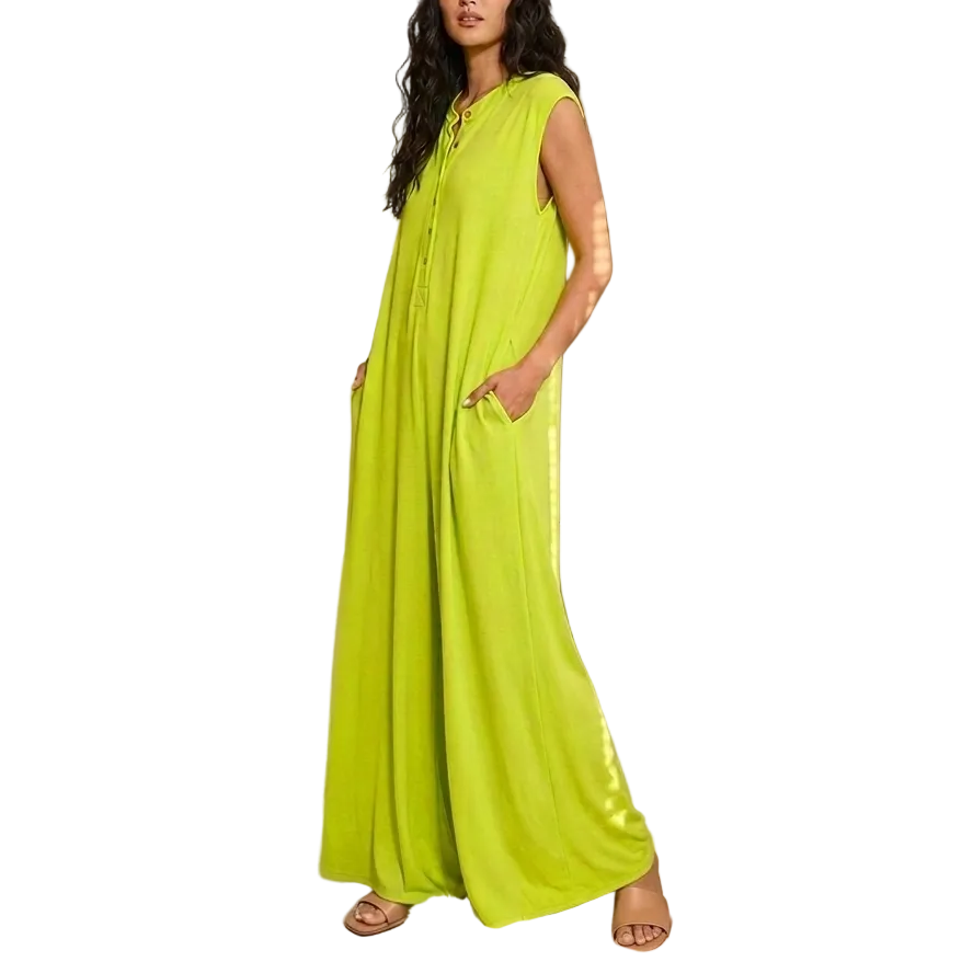 Woman in a bright green dress standing in an art gallery.