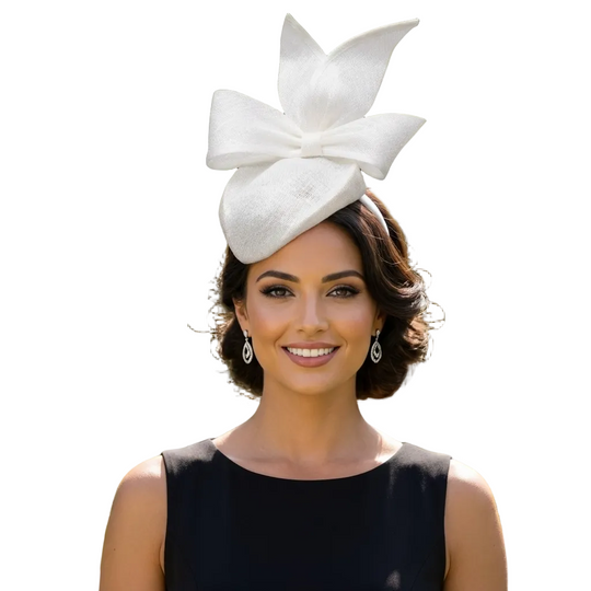 Woman wearing a white floral hat with a black dress outdoors.