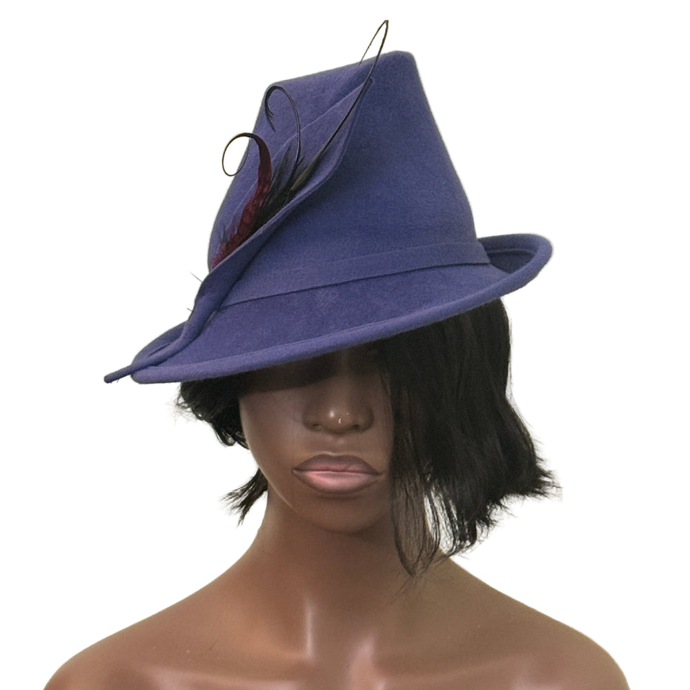 Mannequin head wearing a purple hat with a feather against a beige background