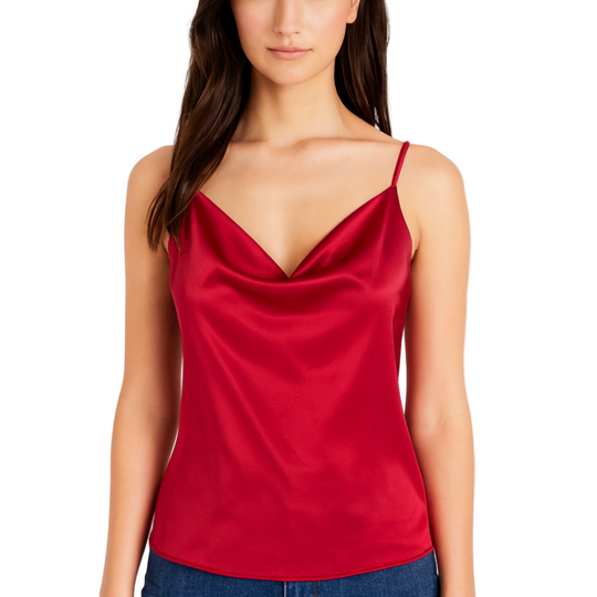 Woman wearing a red satin camisole against a white background