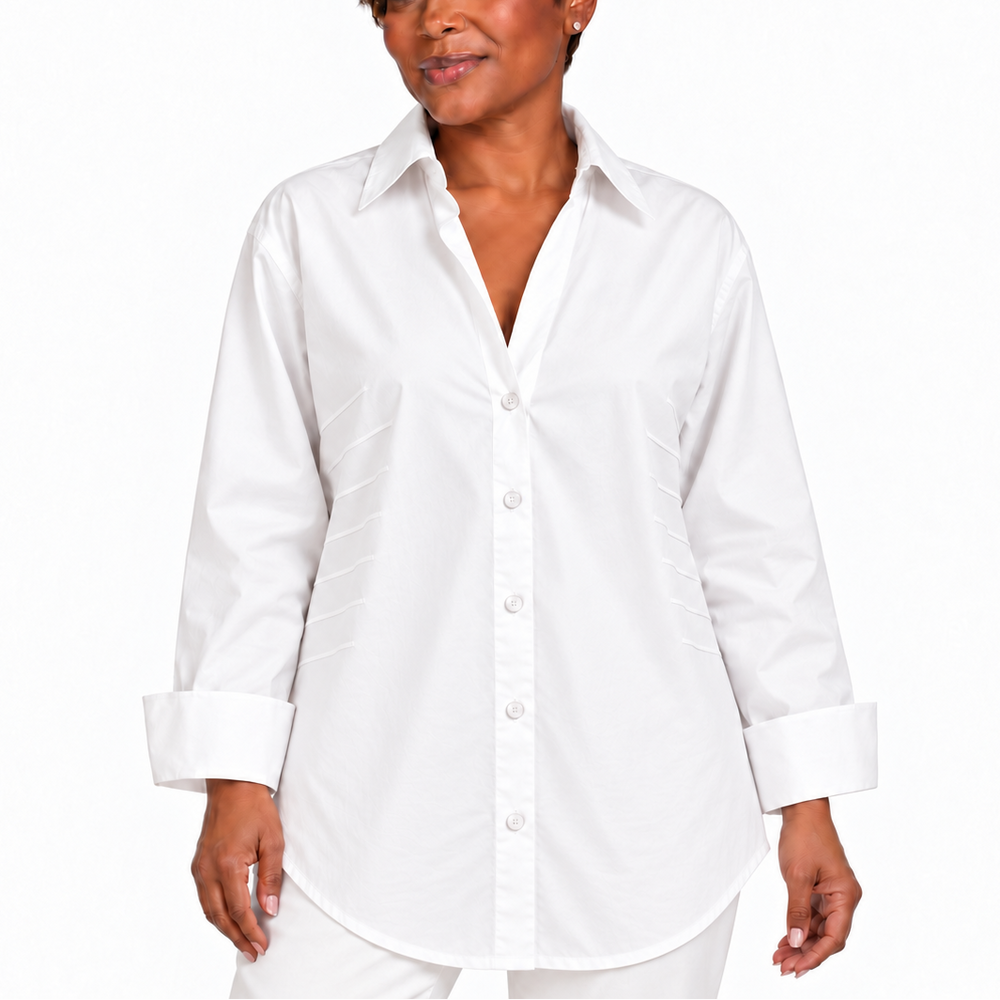 A woman modeling a white long-sleeve button-up shirt with a pointed collar, front buttons, and cuffed sleeves, photographed against a plain white studio background.