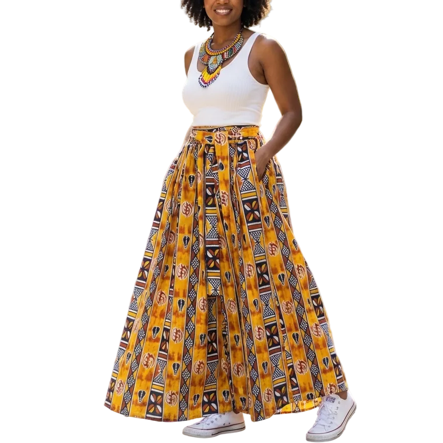 Woman wearing a yellow patterned skirt and white top on a city street.