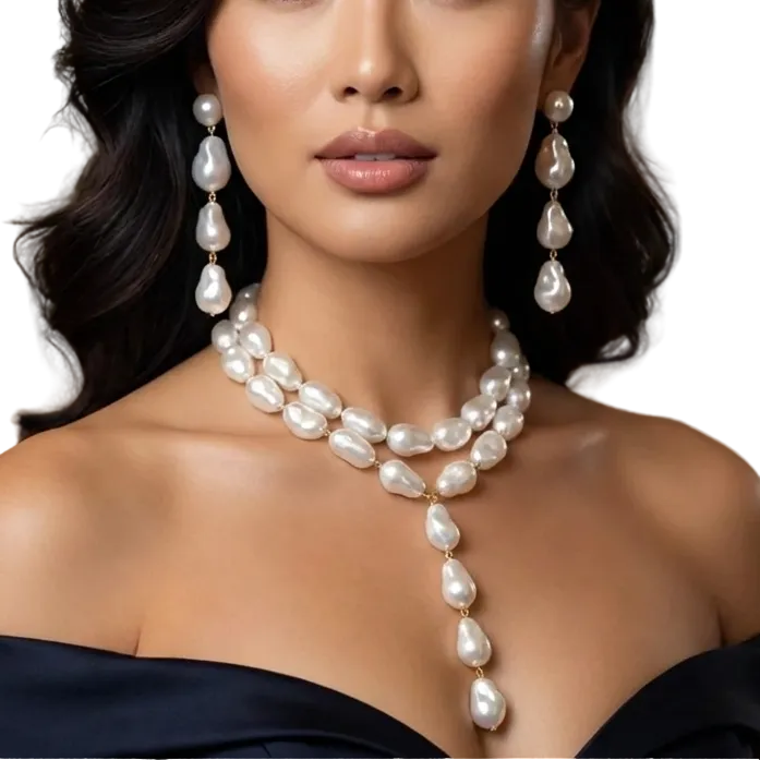 Woman wearing a pearl necklace and earrings in an elegant indoor setting