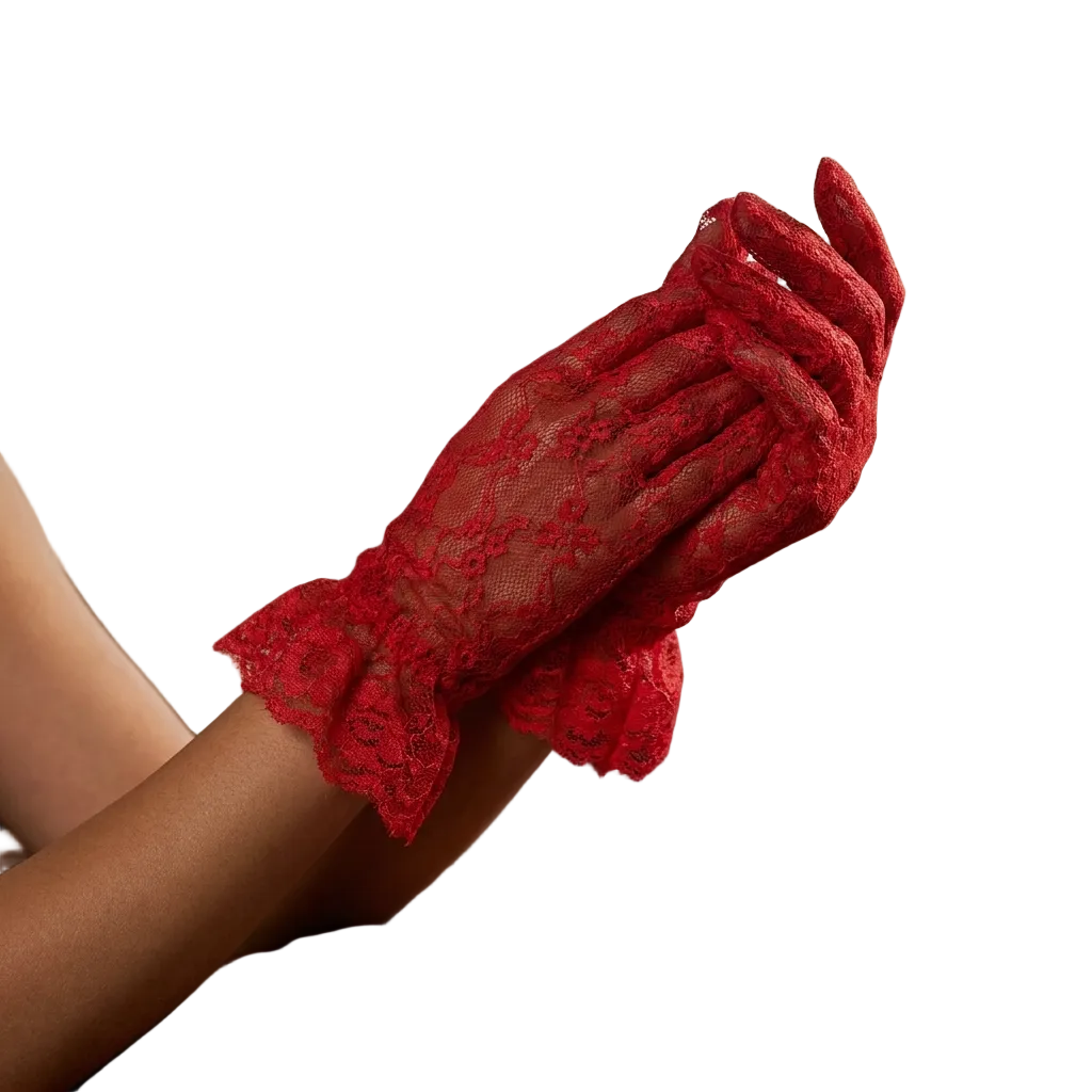 Red lace glove held by a person in a softly lit room.