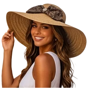 Woman in a white dress and sun hat standing on a picturesque street with ocean view.
