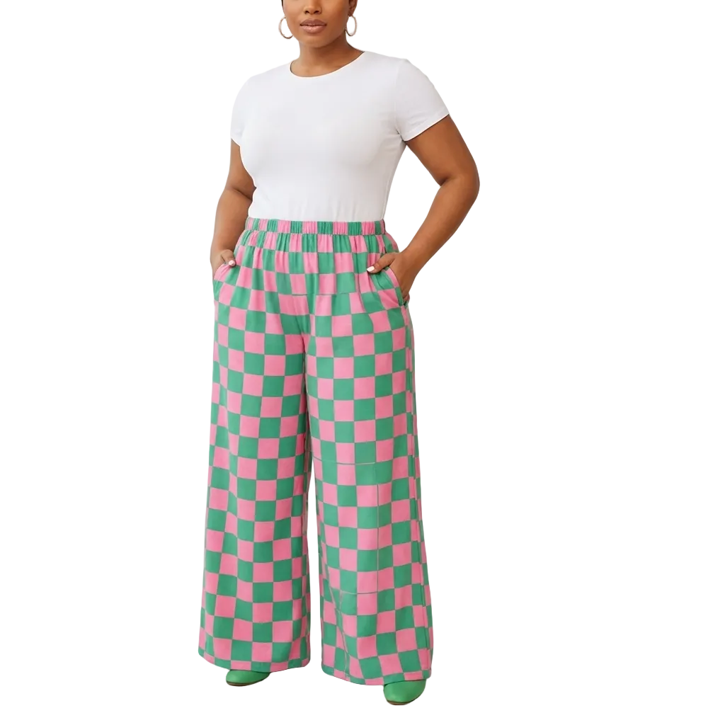 Person wearing pink and green checkered pants on a white background