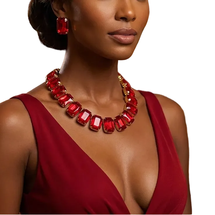 Woman wearing a red dress and necklace with a blurred background