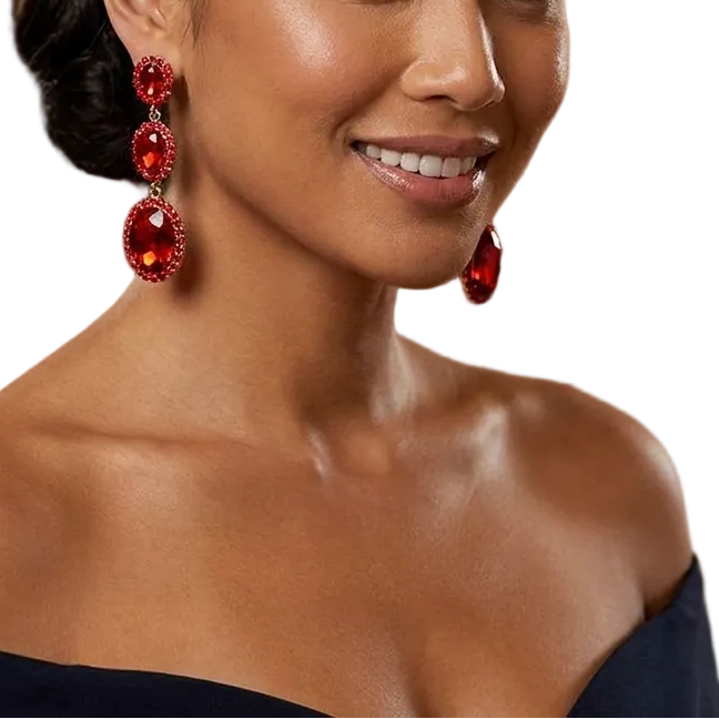 Woman wearing red earrings in a formal setting