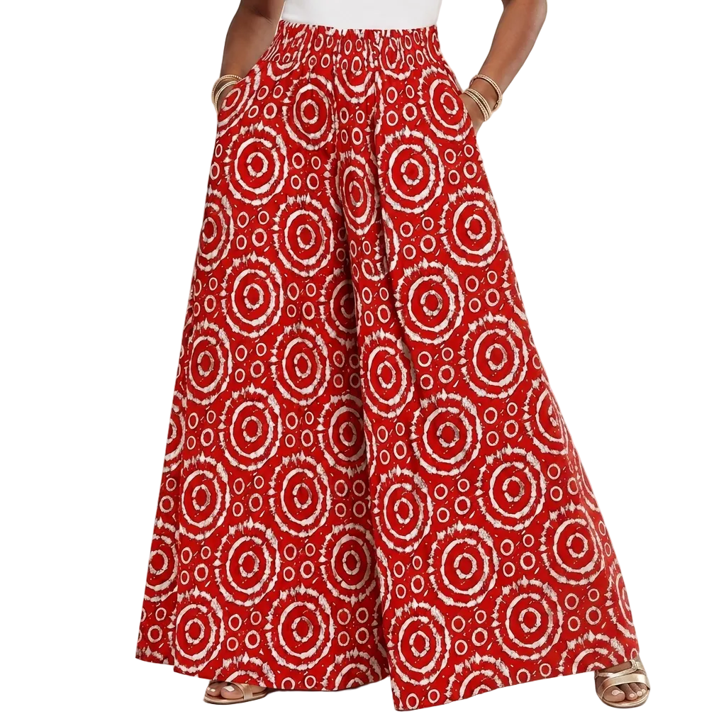 Red wide-leg pants with a white circular tie-dye pattern, shown on a model from the waist down against a white studio background.