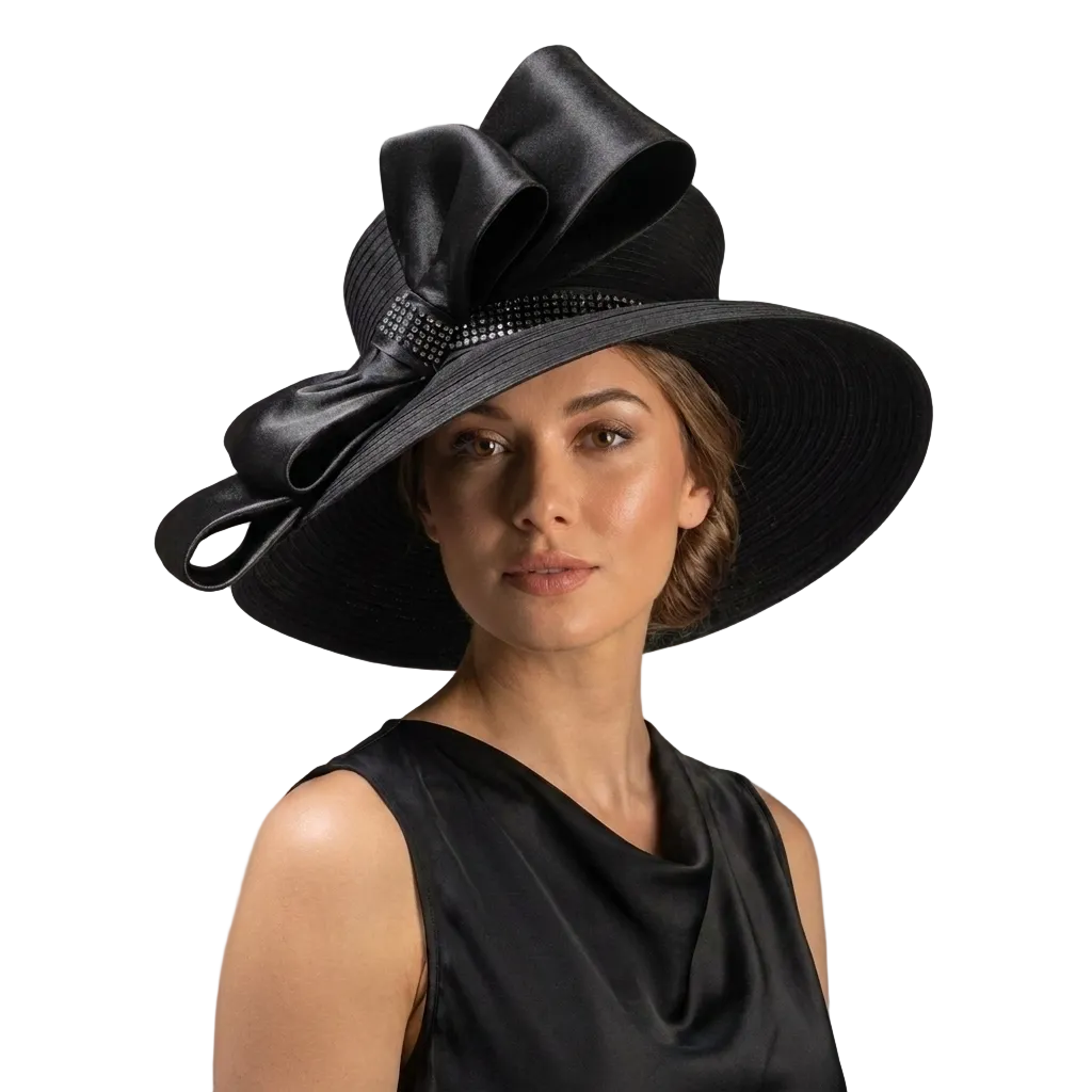 Woman wearing a black hat with a large bow on a gray background