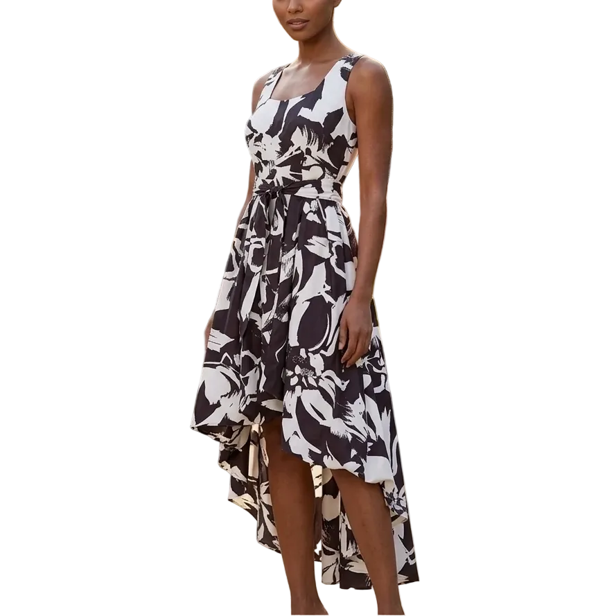 Black and white abstract print high-low bubble dress with square neckline and self-tie waist belt styled for an elegant evening event