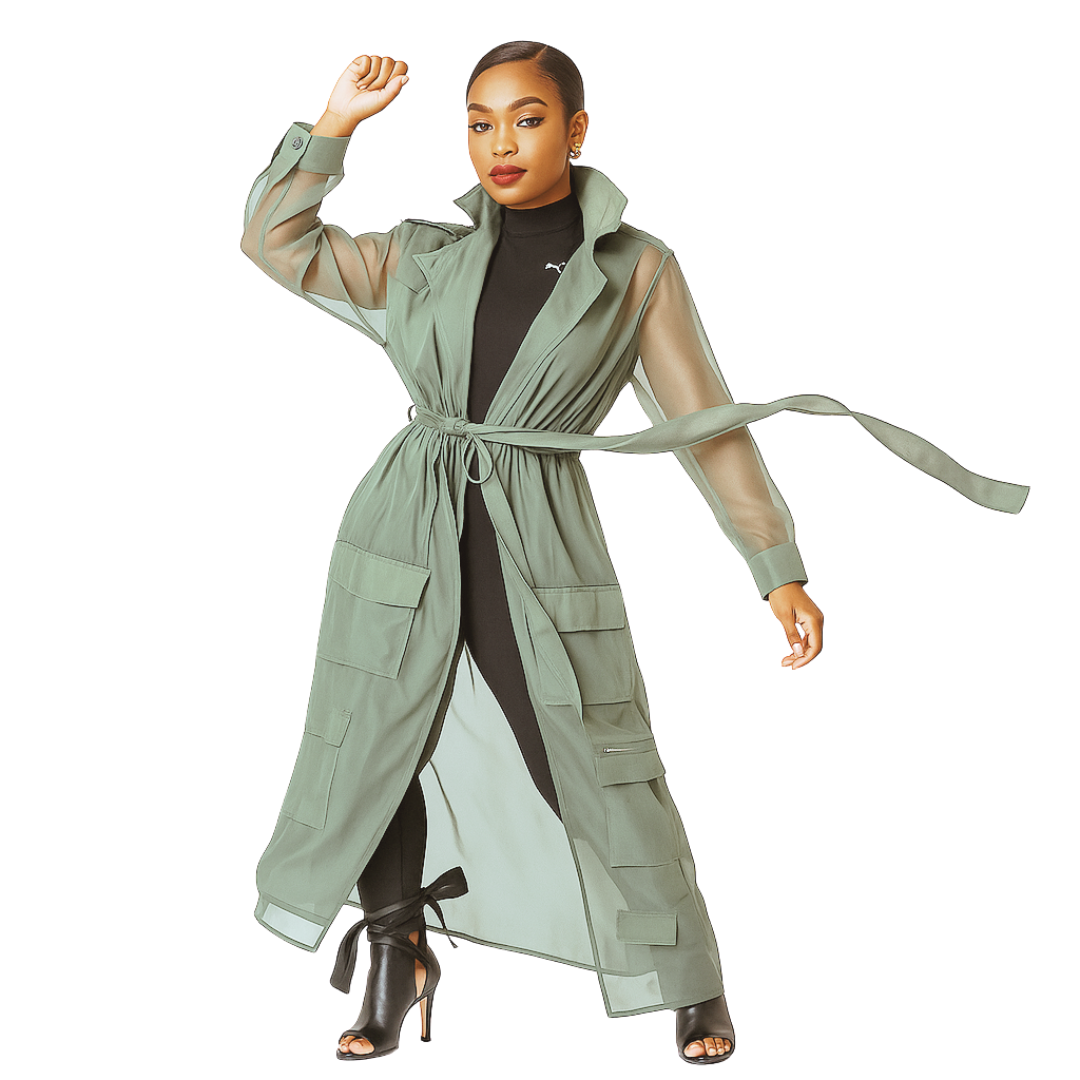 Woman wearing a long green trench coat on a white background