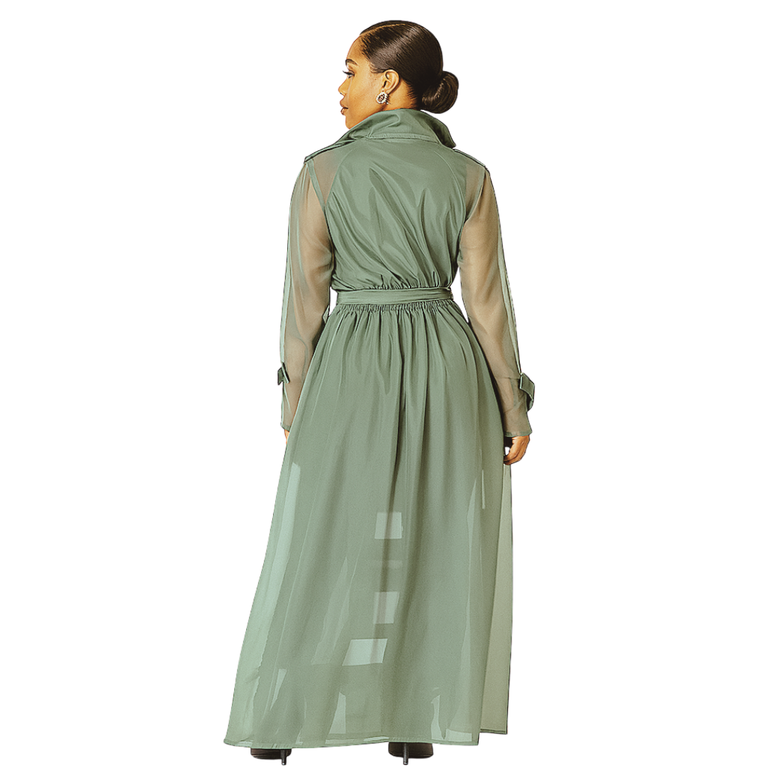 Woman wearing a green trench coat with sheer sleeves on a white background