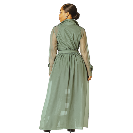 Woman wearing a green trench coat with sheer sleeves on a white background