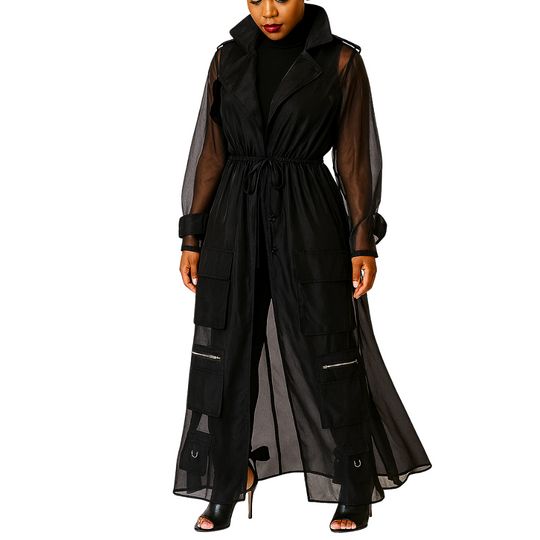 Black long dress with sheer sleeves and panels on a white background