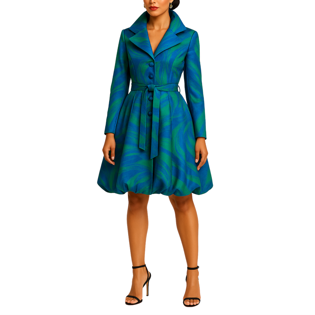 Woman wearing a blue and green patterned dress on a white background