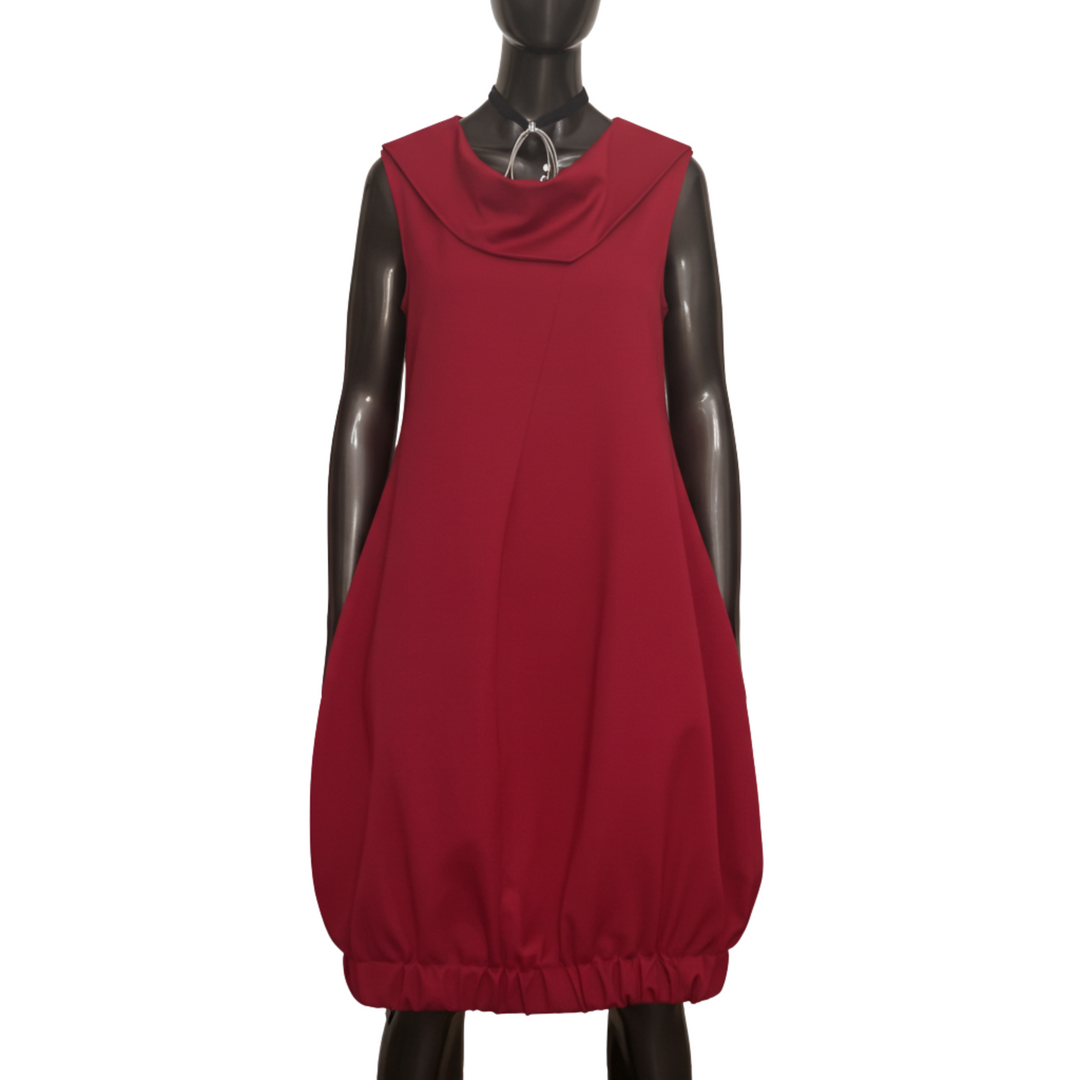 Red dress on a mannequin against a white background