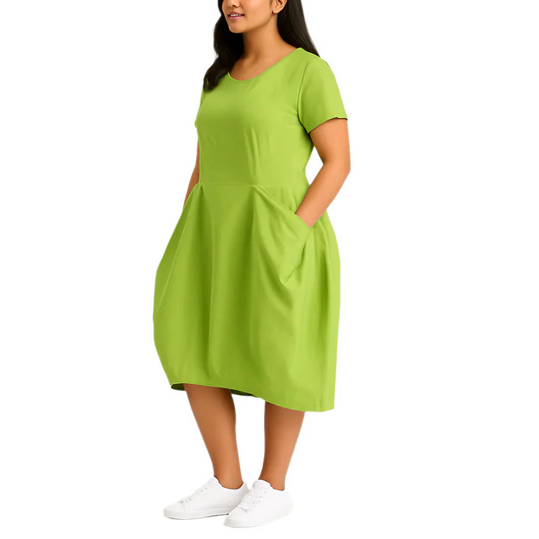 Woman wearing a green dress on a white background