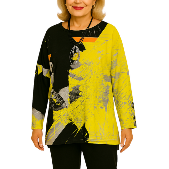 Woman wearing a yellow and black abstract patterned top on a white background