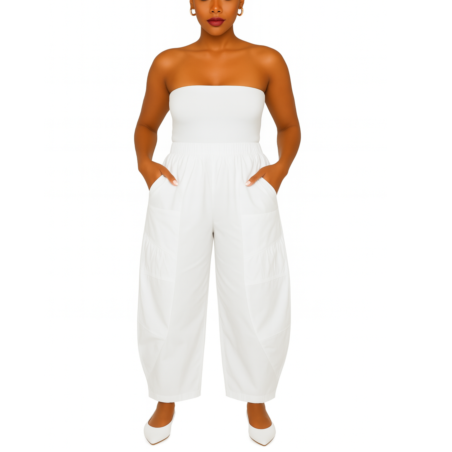 Woman wearing a white strapless jumpsuit on a white background