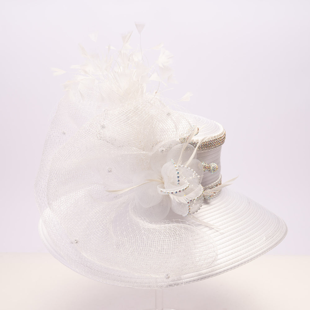 White satin sailor hat with large mesh crinoline bow, crystal accents, rhinestone band, and wide brim