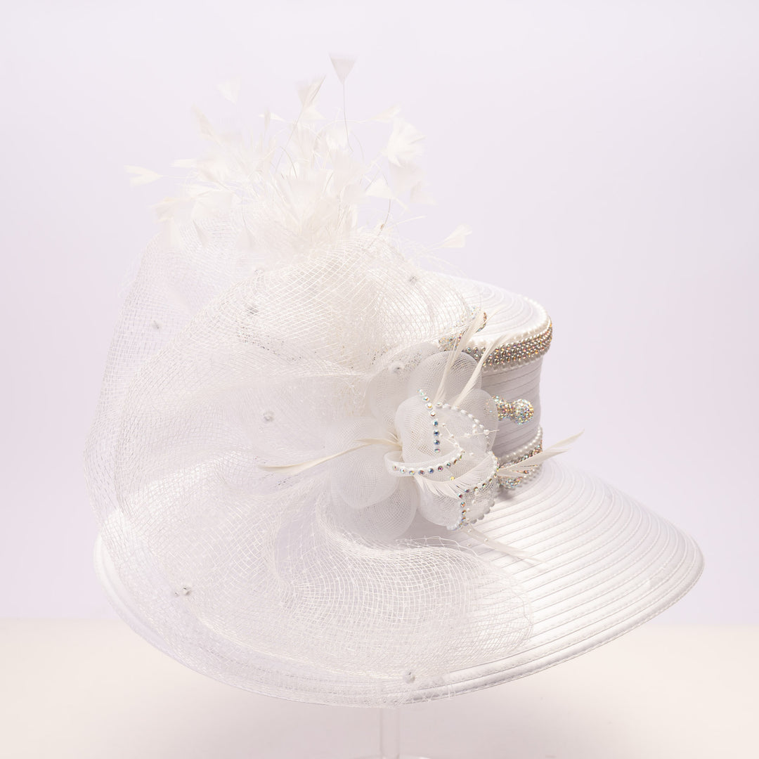 White satin sailor hat with large mesh crinoline bow, crystal accents, rhinestone band, and wide brim