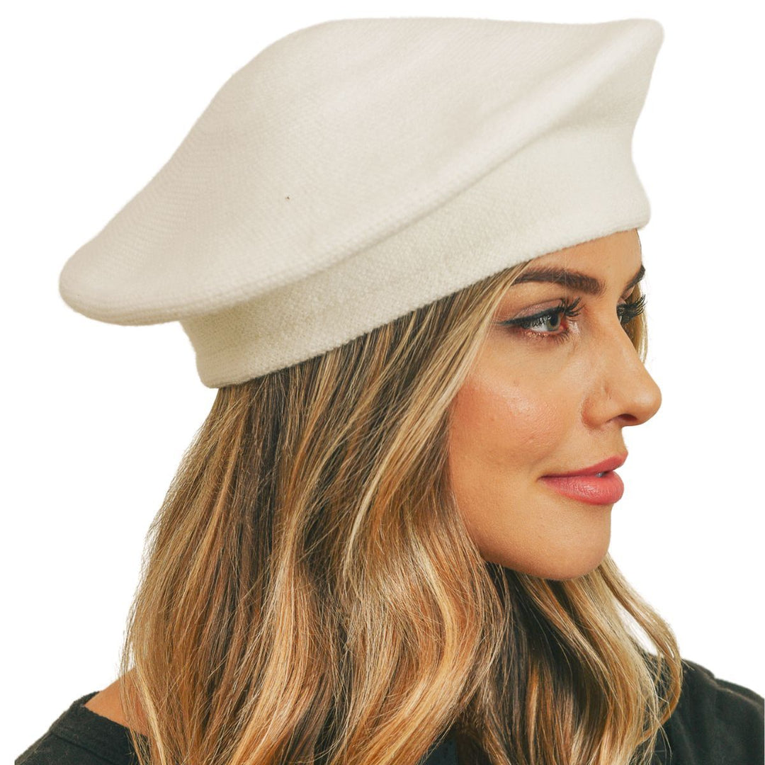 Woman wearing a beige beret on a white background